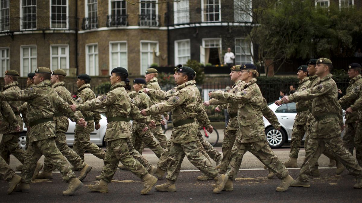 Members of the British military's 4th Mechanised Brigade parade through central London to attend a reception at the Houses of Parliament, Monday, April 22, 2013.