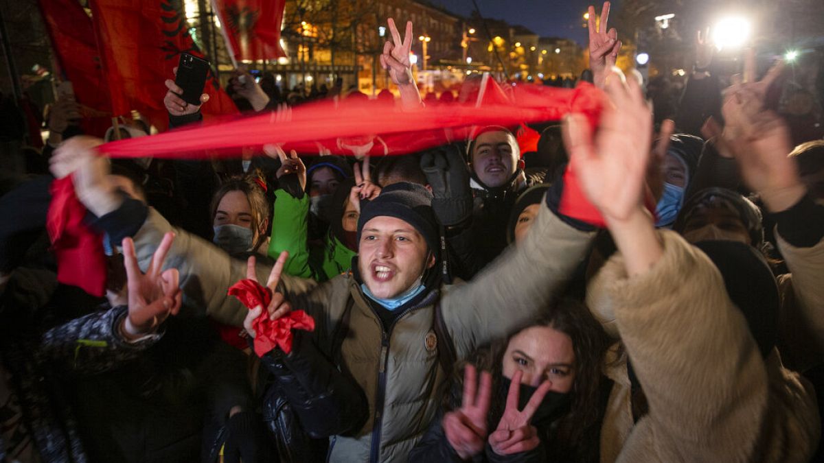 Supporters of the left-wing Self-Determination Movement party react in Pristina, the capitol of Kosovo, on Sunday, Feb. 14, 2021.