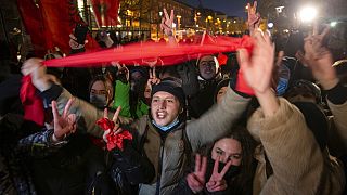 Supporters of the left-wing Self-Determination Movement party react in Pristina, the capitol of Kosovo, on Sunday, Feb. 14, 2021.