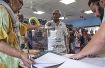 A man casts his vote in Noumea, New Caledonia, Sunday, Oct. 4, 2020, during a referendum whether voters choose independence from France.