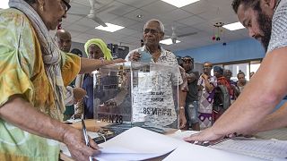 A man casts his vote in Noumea, New Caledonia, Sunday, Oct. 4, 2020, during a referendum whether voters choose independence from France.