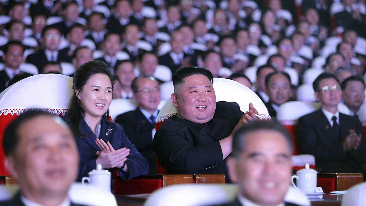 In this photo provided by the North Korean government, North Korean leader Kim Jong Un and his wife Ri Sol Ju watch a performance marking birth anniversary of Kim Jong Il