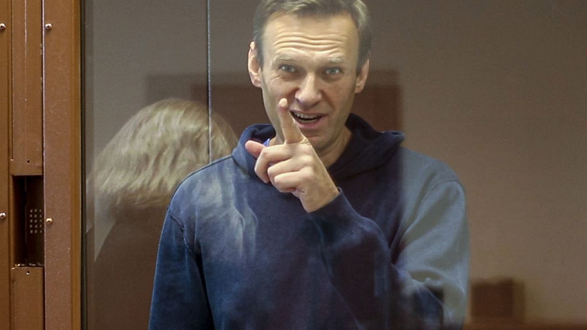 Russian opposition leader Alexei Navalny gestures during a hearing on his charges for defamation in the Babuskinsky District Court in Moscow, Russia, February 16, 2021.