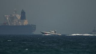 ILLUSTRATION: An Emirati coast guard vessel passes an oil tanker off the coast of Fujairah, United Arab Emirates, May 13, 2019.