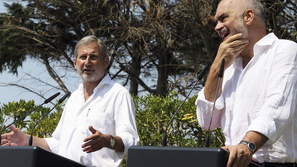 FILE: European Union's enlargement commissioner Johannes Hahn speaks during a news conference next to Albanian Prime Minister Edi Rama, right, in Durres in August 2017
