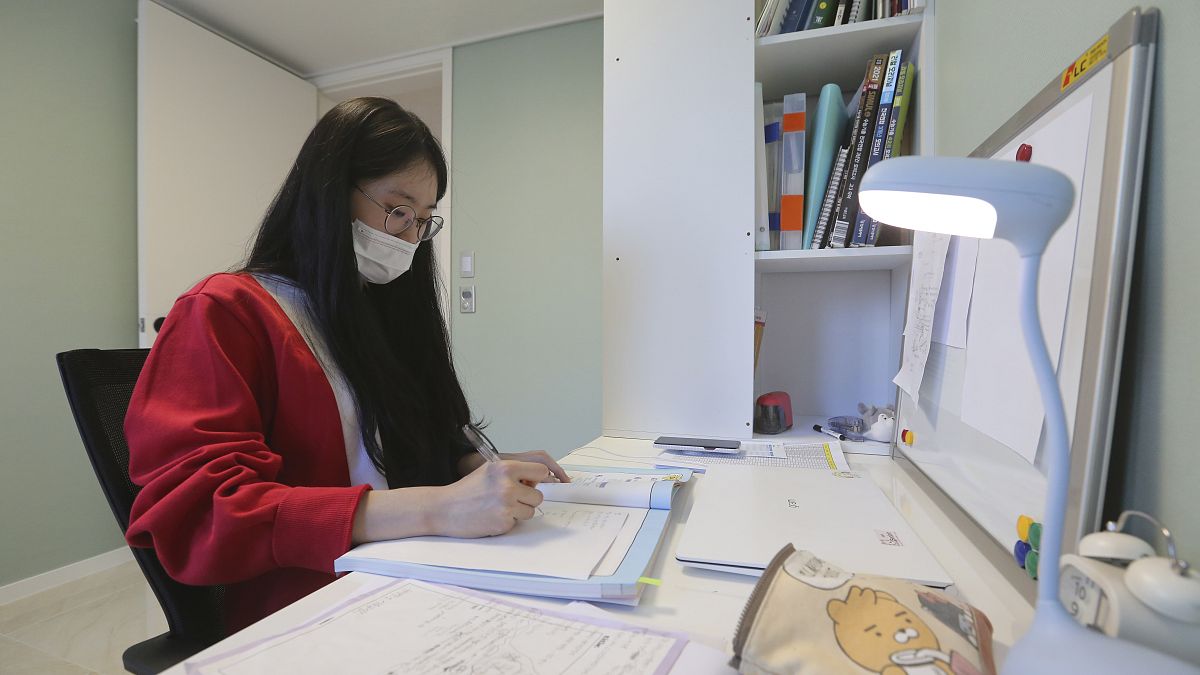 A high school senior studies at her home in Siheung, South Korea.
