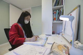 A high school senior studies at her home in Siheung, South Korea.