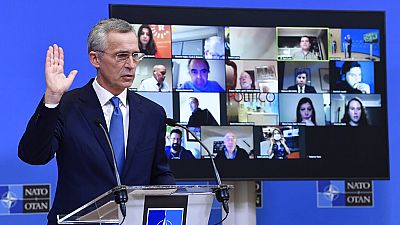 NATO Secretary-General Jens Stoltenberg gestures as he addresses a media conference following a virtual meeting of NATO defense ministers at NATO HQ in Brussels on Wednesday