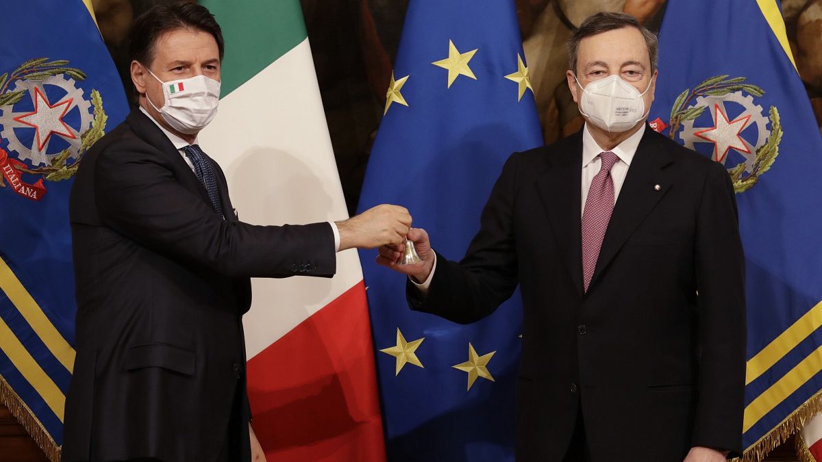 Italian outgoing Premier Giuseppe Conte hands over the cabinet minister bell to new Premier Mario Draghi.