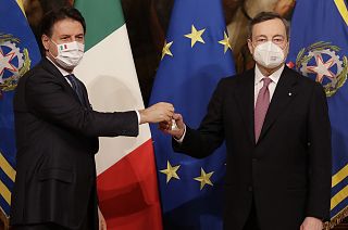 Italian outgoing Premier Giuseppe Conte hands over the cabinet minister bell to new Premier Mario Draghi.