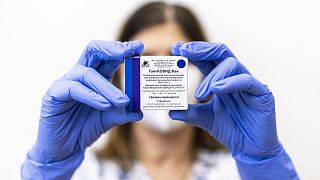 A health worker shows a box of the Russian vaccine Sputnik V at Szent Janos Hospital in Budapest, Hungary.