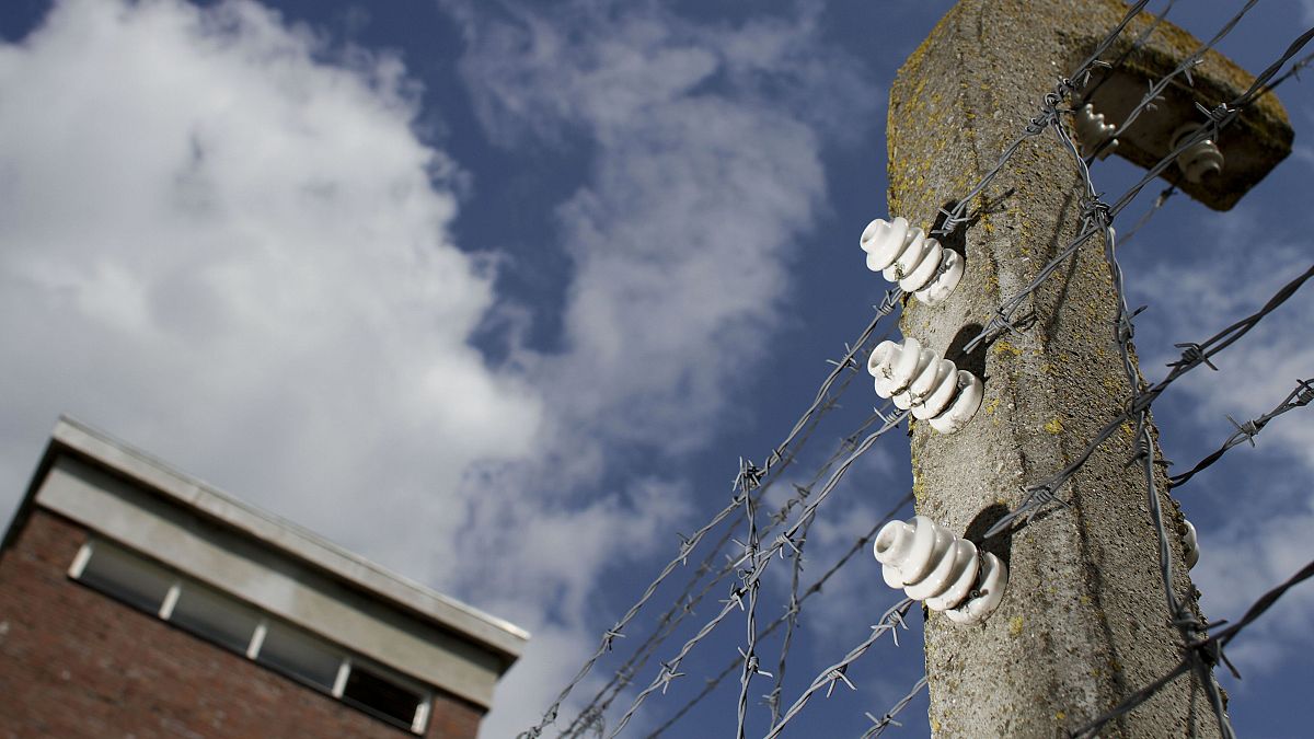 Barbed wire on concrete poles is seen at the memorial site of the former Nazi concentration camp 'Neuengamme'