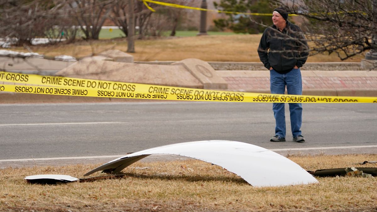 A piece of debris from a commercial airplane is surrounded by police tape on a strip along Midway Boulevard in Broomfield, Colorado. Feb. 20, 2021.