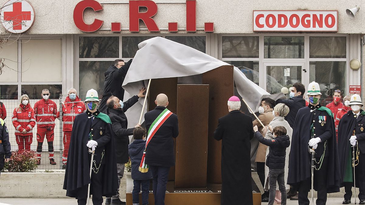 Authorities unveil a memorial for COVID deaths, in Codogno, northern Italy, Sunday, Feb. 21, 2021