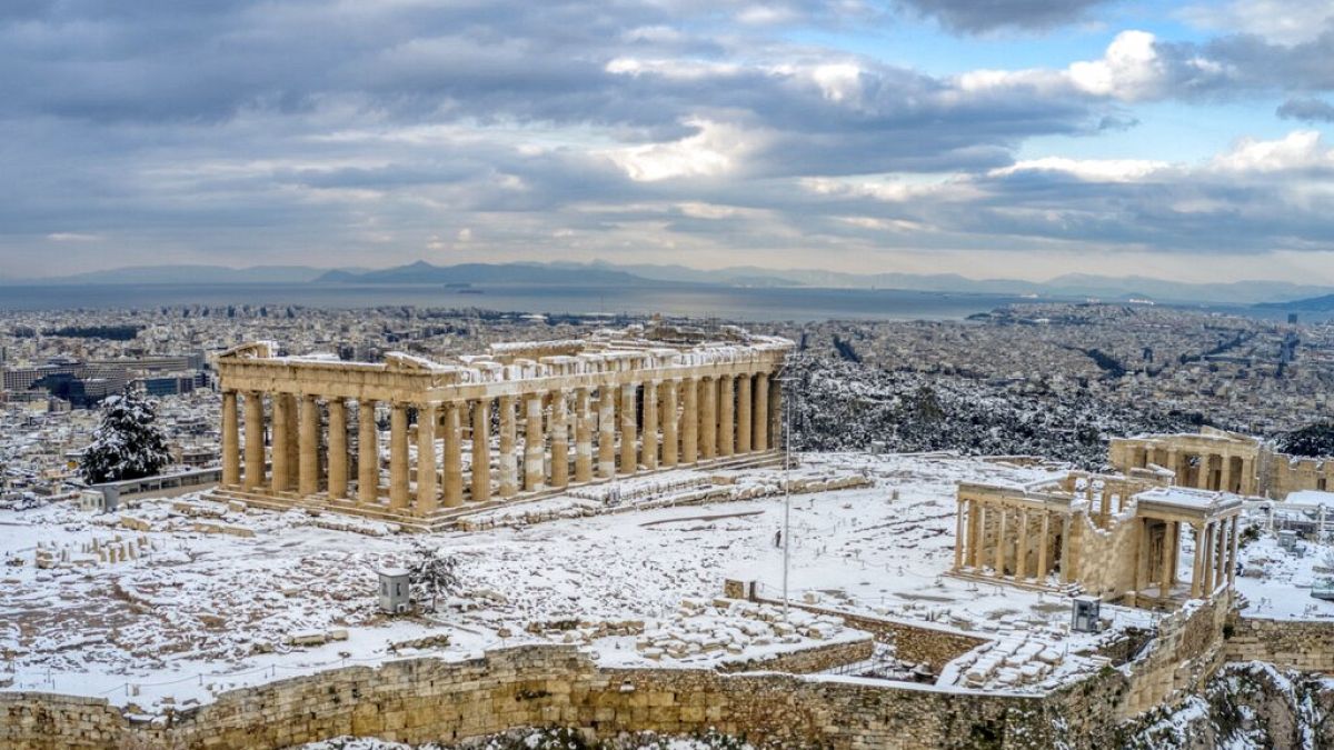 A rare sight of the ancient Acropolis covered in snow in Athens, Wednesday, Feb. 17, 2021