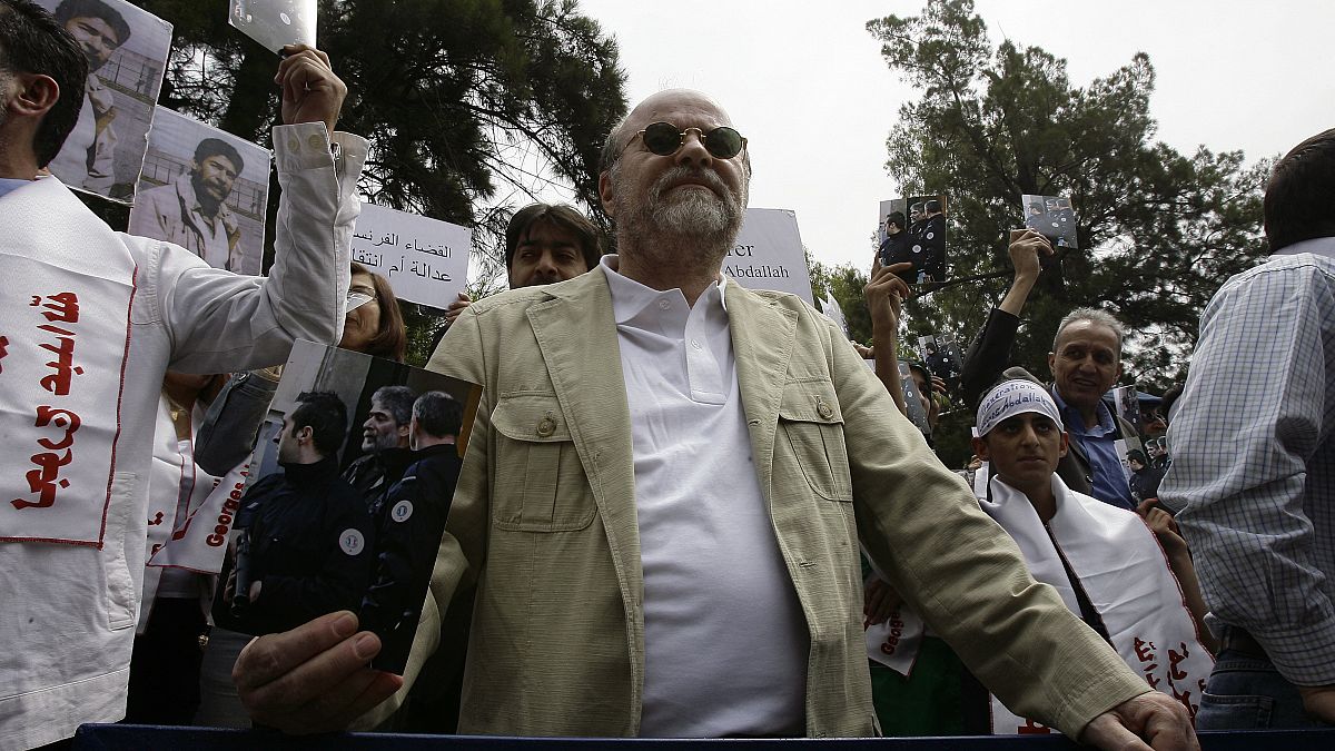 أنيس النقاش خلال مظاهرة مطالبة بإطلاق سراح جورج عبد الله من السجون الفرنسية 