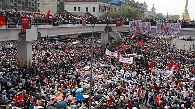 Anti-coup protesters gather at an intersection near the Sule Pagoda in downtown Yangon, Myanmar, Monday, Feb. 22, 2021.