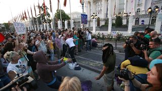 Protestors use an improvised slingshot to throw balloons with colored paint on the Government building during an anti-government protest in Skopje, Macedonia, in 2016.