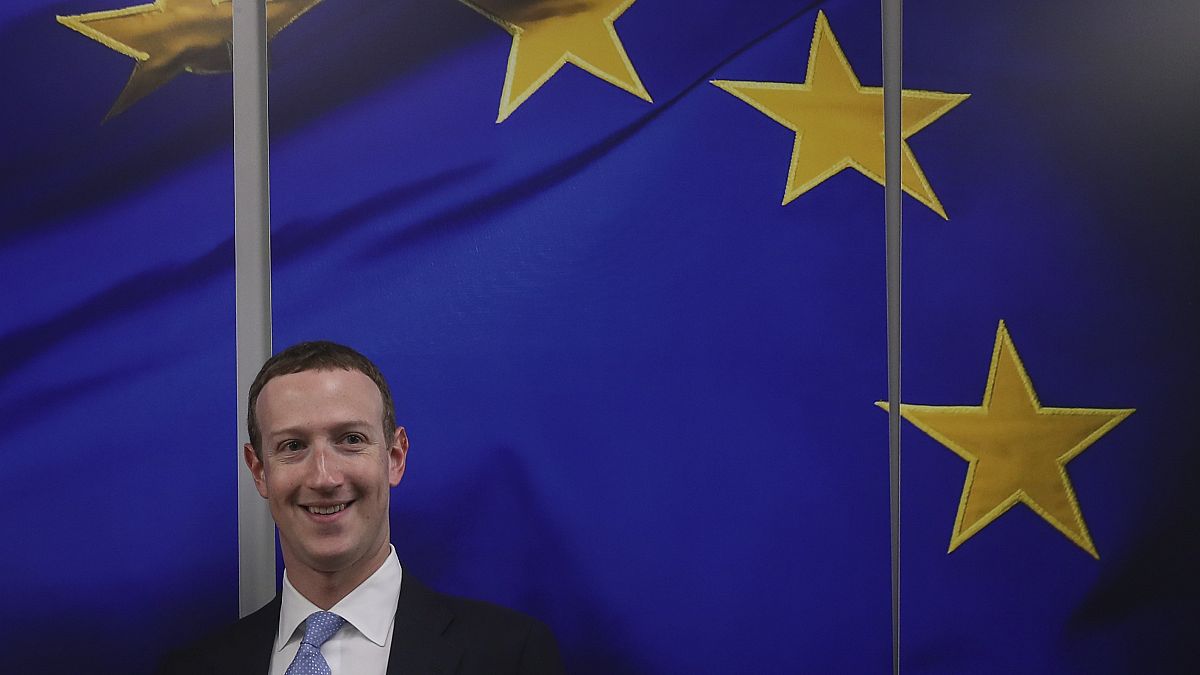 Facebook CEO Mark Zuckerberg smiles as he shakes hands prior to a meeting with European Commissioner for Values and Transparency Vera Jourova in Brussels - Feb 2020
