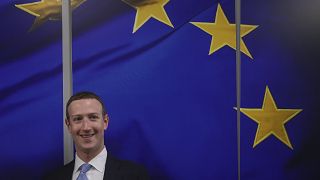 Facebook CEO Mark Zuckerberg smiles as he shakes hands prior to a meeting with European Commissioner for Values and Transparency Vera Jourova in Brussels - Feb 2020