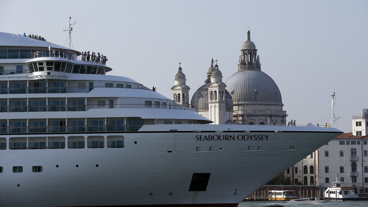 A cruise ship manoeuvres through the Giudecca canal in front of St. Mark's Square, in Venice, Italy. 