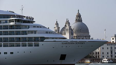 A cruise ship manoeuvres through the Giudecca canal in front of St. Mark's Square, in Venice, Italy.