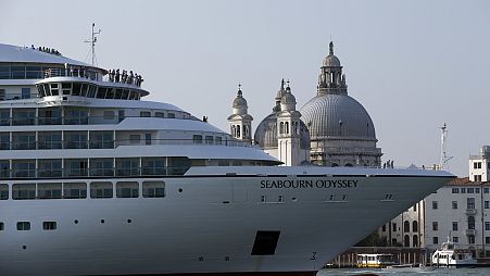 A cruise ship manoeuvres through the Giudecca canal in front of St. Mark's Square, in Venice, Italy. 