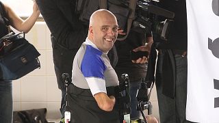 Limbless Philippe Croizon from France, smiles, after he set a world record to scuba dive 33 meters deep in Brussels, Thursday, Jan. 10, 2013. 