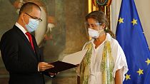 European Union Ambassador to Venezuela Isabel Brilhante Pedrosa is presented with a letter of "persona non grata" from Venezuelan Foreign Minister Jorge Arreaza in Caracas.