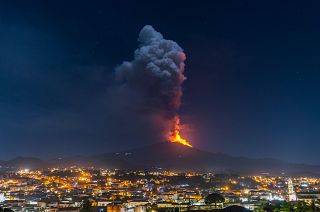Flames and smoke billowing from a crater of the Mount Etna volcano, Sicily. February 24, 2021