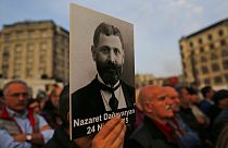 Protesters hold portraits of Armenian intellectuals during a rally to commemorate the anniversary of the 1915 mass killings.