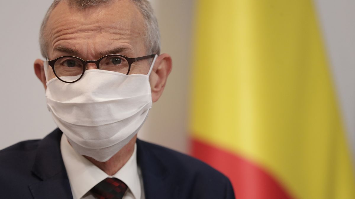 Belgium's Minister of Health and Social Affairs Frank Vandenbroucke wears a facemask during an October press conference.