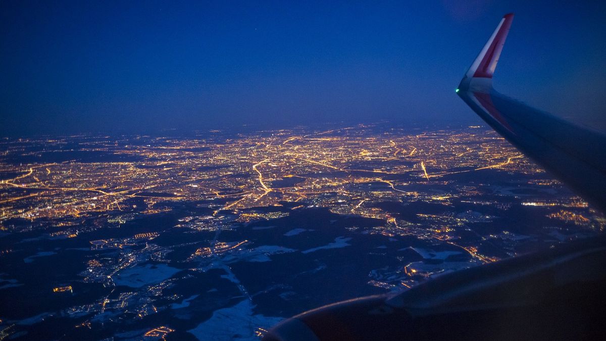 The Illuminated city of Moscow seen through the window of an aircraft coming in to land at Sheremetyevo airport outside Moscow, Russia.