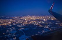 The Illuminated city of Moscow seen through the window of an aircraft coming in to land at Sheremetyevo airport outside Moscow, Russia.