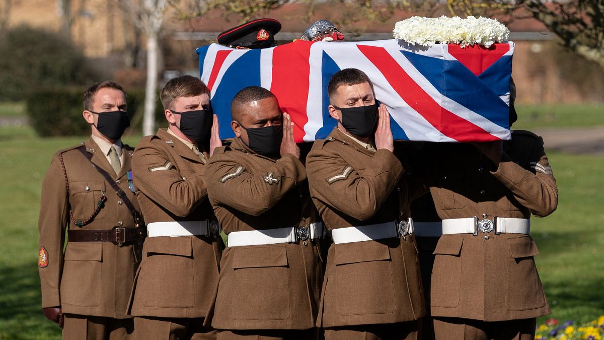 Soldiers from the British Army's Yorkshire Regiment carry the coffin of Captain Tom Moore during his funeral service at Bedford Crematorium.