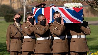 Soldiers from the British Army's Yorkshire Regiment carry the coffin of Captain Tom Moore during his funeral service at Bedford Crematorium.