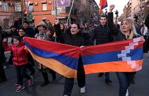 Opposition demonstrators carrying Armenian national and region of Nagorno-Karabakh’s flag. Armenia, Saturday, Feb. 27, 2021.