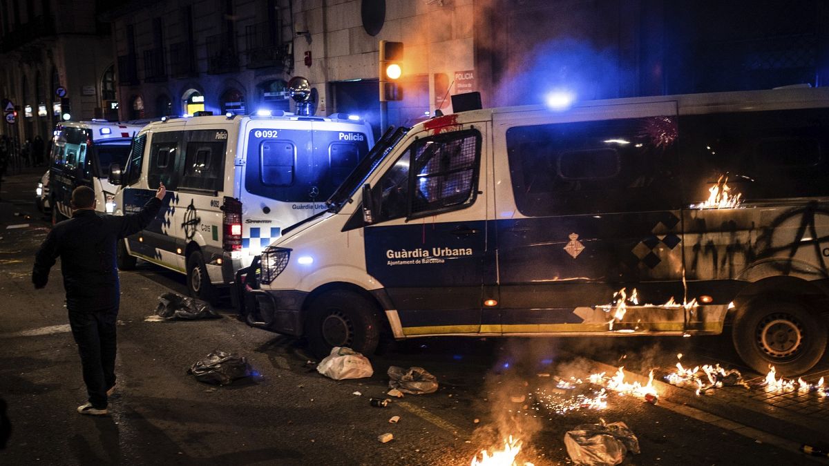 A police van burns after being attacked by demonstrators during a protest condemning the arrest of rap singer Pablo Hasél in Barcelona, Spain, Saturday, Feb. 27, 2021.