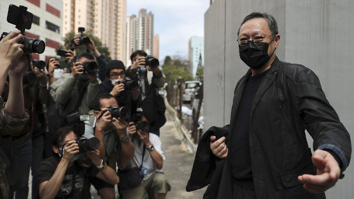 Former law professor Benny Tai, who was arrested under Hong Kong's national security law, walking to a police station in Hong Kong Sunday, Feb. 28, 2021.