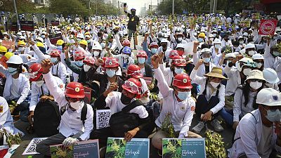 Protesters shout slogans during a protest against the military coup in Mandalay, Myanmar, Sunday, Feb. 28, 2021.