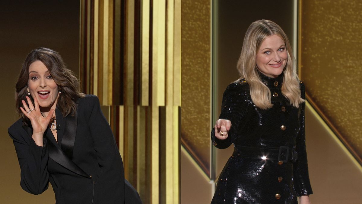 Tina Fey, left, from New York, and Amy Poehler, from Beverly Hills, Calif., speak at the Golden Globe Awards on Feb. 28, 2021.
