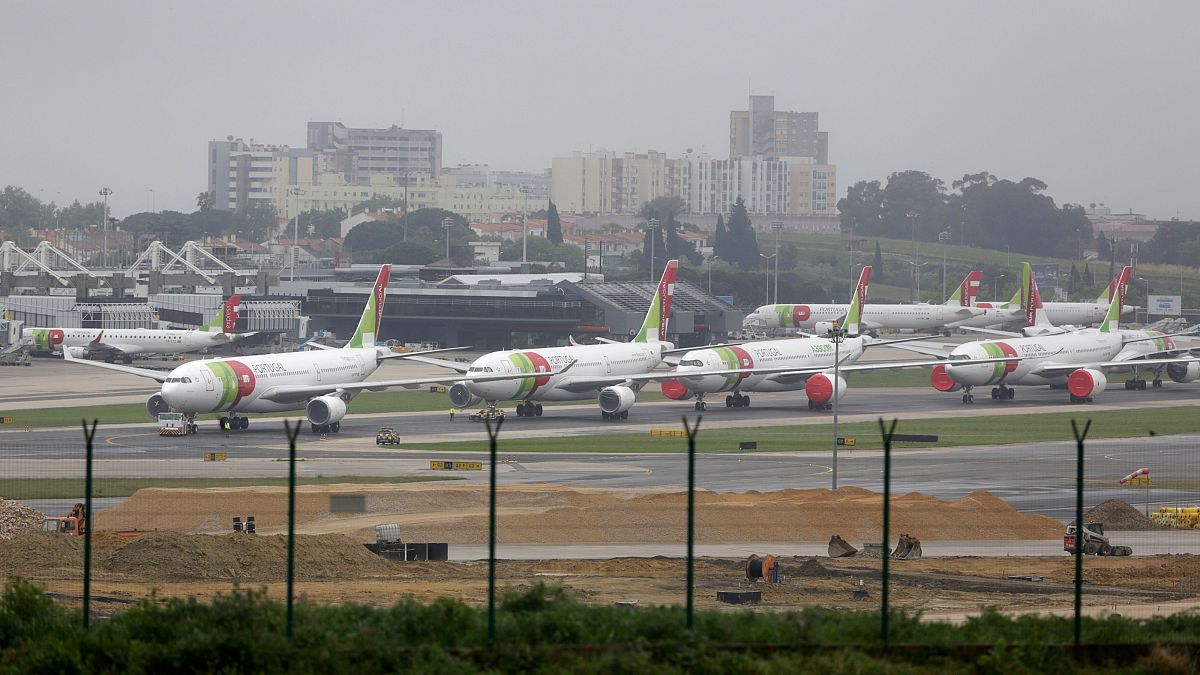 TAP Air Portugal airplanes lined up at Lisbon's airport
