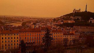 A view of Lyon, France, taken on February 6, 2021, as dust from the Saharan coloured the sky red.