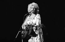 Dolly Parton performs during her Tokyo concert on Monday, July 30, 1979. (AP Photo/Tsugufumi Matsumoto)