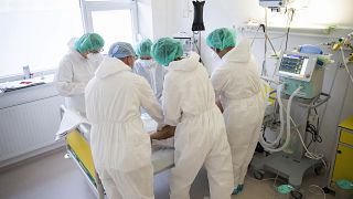 Doctors and nurses attend to a patient at the intensive care unit for COVID-19 patients in the Andras Josa hospital in Nyiregyhaza.