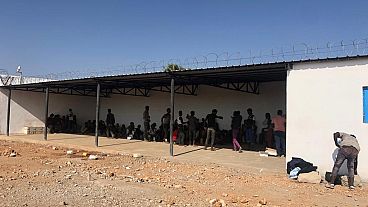 Survivors wait outside the Migrant Response Centre in Obock, Djibouti - IOM