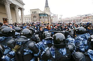 Jan. 31, 2021 file photo, people clash with police during a protest against the jailing of opposition leader Alexei Navalny in Moscow, Russia.