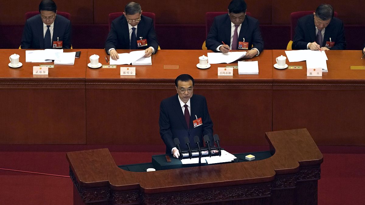 Chinese Premier Li Keqiang delivers a speech during China's National People's Congress (NPC) at the Great Hall of the People in Beijing, Friday, March 5, 2021. 