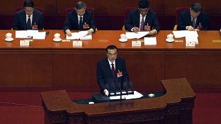 Chinese Premier Li Keqiang delivers a speech during China's National People's Congress (NPC) at the Great Hall of the People in Beijing, Friday, March 5, 2021. 