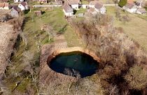 Experts say December's earthquake has accelerated the appearance of sinkholes in the area.